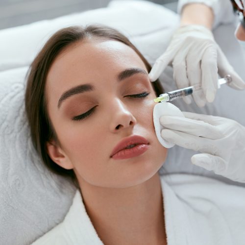 Cosmetology Procedure. Woman Receiving Face Skin Lift Injections Cosmetology Procedure. Woman Receiving Face Skin Lift Injections Around Eyes. High Resolution